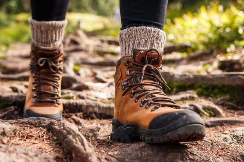 Hiking boots on a trail - critical part of the checklist.